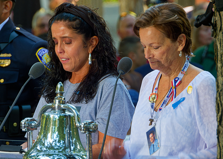 The reading of the names of the victims. This year many of the readers honored grandparents they had never met. Photo: Carl Glassman/Tribeca Trib